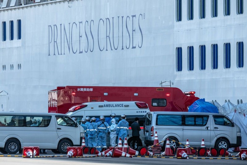 YOKOHAMA, JAPAN - FEBRUARY 06: An ambulance carries a coronavirus victim from the Diamond Princess cruise ship while it is docked at Daikoku Pier where it will be resupplied and newly diagnosed coronavirus cases taken to hospital as it remains in quarantine off the port of Yokohama after a number of the 3,700 people on board were confirmed to have coronavirus, on February 6, 2020 in Yokohama, Japan. 20 passengers are confirmed to be infected with coronavirus as Japanese authorities continue screening people on board. The new cases bring the total number of confirmed infections to 45 in Japan, the largest number outside of China. (Photo by Carl Court/Getty Images)