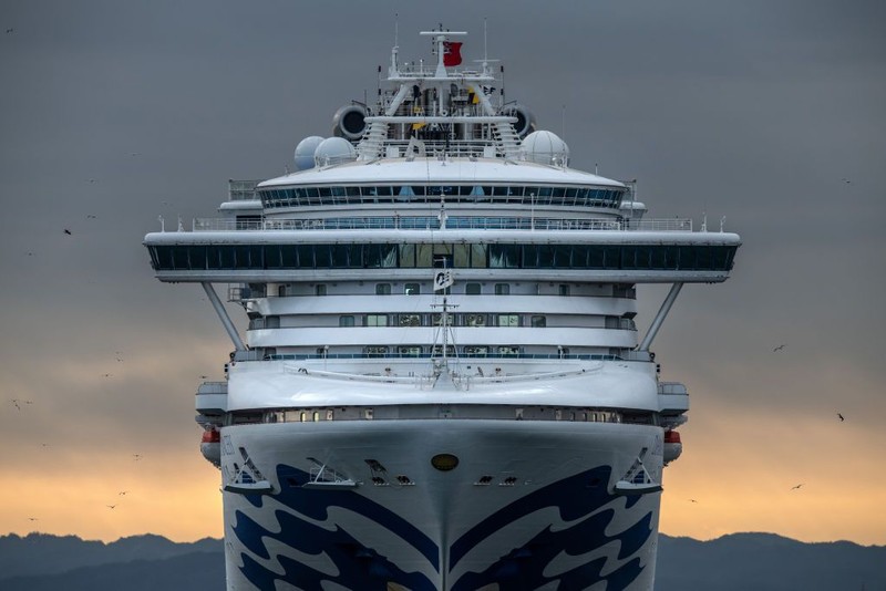 YOKOHAMA, JAPAN - FEBRUARY 06: An ambulance carries a coronavirus victim from the Diamond Princess cruise ship while it is docked at Daikoku Pier where it will be resupplied and newly diagnosed coronavirus cases taken to hospital as it remains in quarantine off the port of Yokohama after a number of the 3,700 people on board were confirmed to have coronavirus, on February 6, 2020 in Yokohama, Japan. 20 passengers are confirmed to be infected with coronavirus as Japanese authorities continue screening people on board. The new cases bring the total number of confirmed infections to 45 in Japan, the largest number outside of China. (Photo by Carl Court/Getty Images)