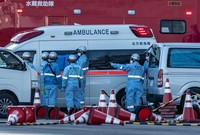 YOKOHAMA, JAPAN - FEBRUARY 06: An ambulance carries a coronavirus victim from the Diamond Princess cruise ship while it is docked at Daikoku Pier where it will be resupplied and newly diagnosed coronavirus cases taken to hospital as it remains in quarantine off the port of Yokohama after a number of the 3,700 people on board were confirmed to have coronavirus, on February 6, 2020 in Yokohama, Japan. 20 passengers are confirmed to be infected with coronavirus as Japanese authorities continue screening people on board. The new cases bring the total number of confirmed infections to 45 in Japan, the largest number outside of China. (Photo by Carl Court/Getty Images)