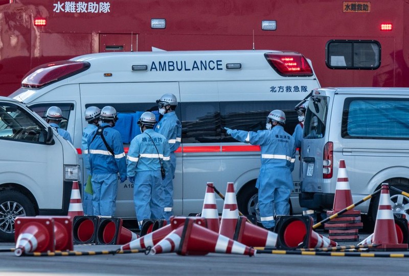 YOKOHAMA, JAPAN - FEBRUARY 06: An ambulance carries a coronavirus victim from the Diamond Princess cruise ship while it is docked at Daikoku Pier where it will be resupplied and newly diagnosed coronavirus cases taken to hospital as it remains in quarantine off the port of Yokohama after a number of the 3,700 people on board were confirmed to have coronavirus, on February 6, 2020 in Yokohama, Japan. 20 passengers are confirmed to be infected with coronavirus as Japanese authorities continue screening people on board. The new cases bring the total number of confirmed infections to 45 in Japan, the largest number outside of China. (Photo by Carl Court/Getty Images)