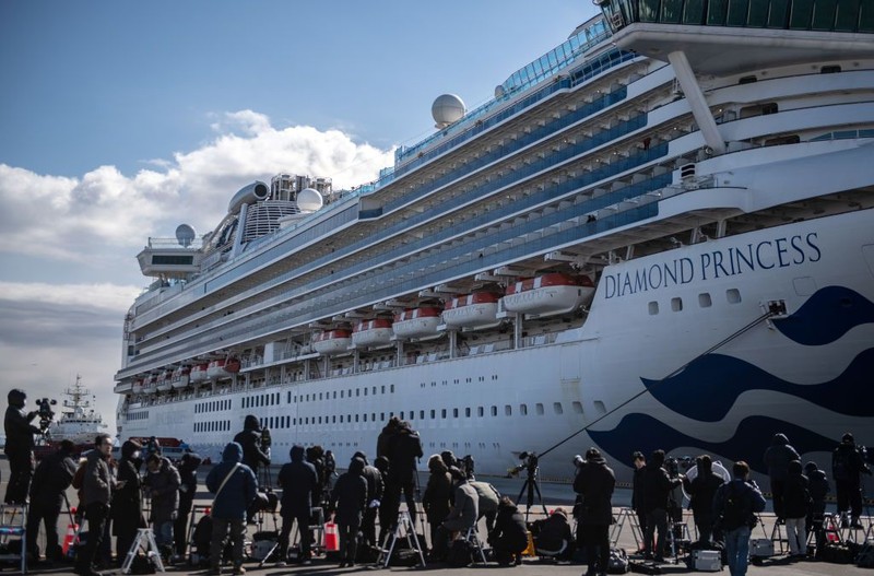YOKOHAMA, JAPAN - FEBRUARY 06: An ambulance carries a coronavirus victim from the Diamond Princess cruise ship while it is docked at Daikoku Pier where it will be resupplied and newly diagnosed coronavirus cases taken to hospital as it remains in quarantine off the port of Yokohama after a number of the 3,700 people on board were confirmed to have coronavirus, on February 6, 2020 in Yokohama, Japan. 20 passengers are confirmed to be infected with coronavirus as Japanese authorities continue screening people on board. The new cases bring the total number of confirmed infections to 45 in Japan, the largest number outside of China. (Photo by Carl Court/Getty Images)