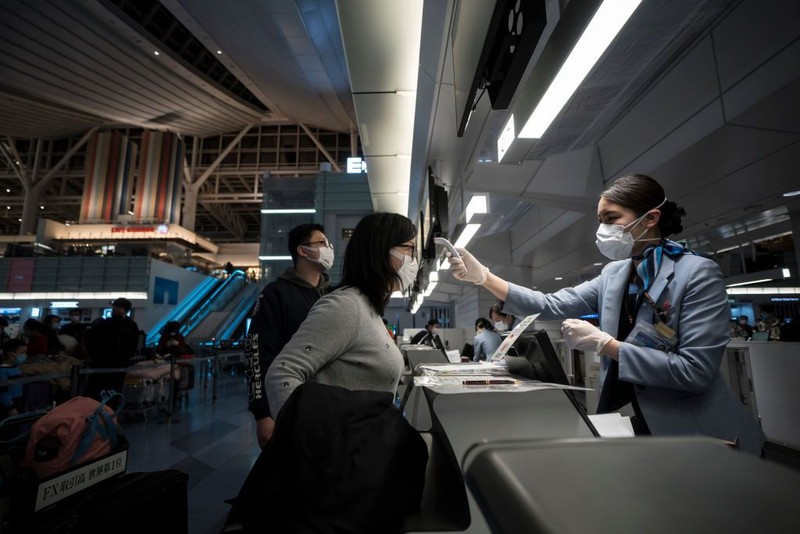 BEIJING, CHINA - JANUARY 30: A sign instructs shoppers to wear protective masks at a mall on January 30, 2020 in Beijing, China. The number of cases of a deadly new coronavirus rose to over 7000 in mainland China Thursday as the country continued to lock down the city of Wuhan in an effort to contain the spread of the pneumonia-like disease which medicals experts have confirmed can be passed from human to human. In an unprecedented move, Chinese authorities put travel restrictions on the city which is the epicentre of the virus and neighbouring municipalities affecting tens of millions of people. The number of those who have died from the virus in China climbed to over 170 on Thursday, mostly in Hubei province, and cases have been reported in other countries including the United States, Canada, Australia, Japan, South Korea, and France. The World Health Organization has warned all governments to be on alert, and its emergency committee is to meet later on Thursday to decide whether to declare a global health emergency. (Photo by Kevin Frayer/Getty Images)
