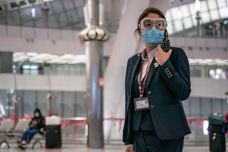 BEIJING, CHINA - JANUARY 30: A sign instructs shoppers to wear protective masks at a mall on January 30, 2020 in Beijing, China. The number of cases of a deadly new coronavirus rose to over 7000 in mainland China Thursday as the country continued to lock down the city of Wuhan in an effort to contain the spread of the pneumonia-like disease which medicals experts have confirmed can be passed from human to human. In an unprecedented move, Chinese authorities put travel restrictions on the city which is the epicentre of the virus and neighbouring municipalities affecting tens of millions of people. The number of those who have died from the virus in China climbed to over 170 on Thursday, mostly in Hubei province, and cases have been reported in other countries including the United States, Canada, Australia, Japan, South Korea, and France. The World Health Organization has warned all governments to be on alert, and its emergency committee is to meet later on Thursday to decide whether to declare a global health emergency. (Photo by Kevin Frayer/Getty Images)