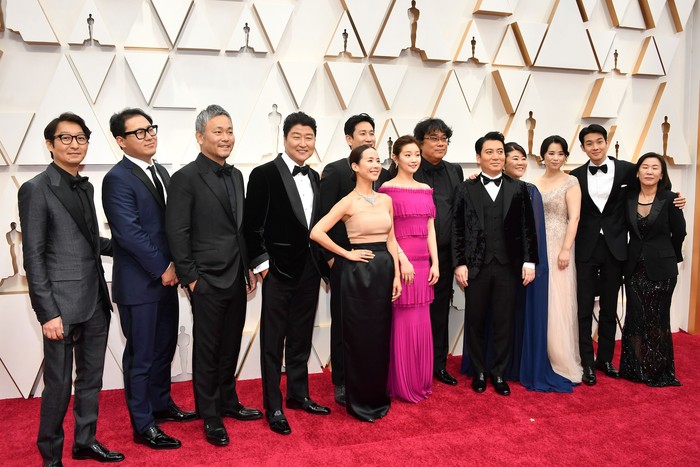 HOLLYWOOD, CALIFORNIA - FEBRUARY 09: Cast and crew of 
'Parasite' including editor Yang Jin-mo, writer Jin Won Han, producer Kwak Sin-ae, production designer Ha-jun Lee, Yang-kwon Moon, Kang-ho Song, Yeo-jeong Jo, Sun-kyun Lee, and filmmaker Bong Joon Ho attend the 92nd Annual Academy Awards at Hollywood and Highland on February 09, 2020 in Hollywood, California. (Photo by Amy Sussman/Getty Images)