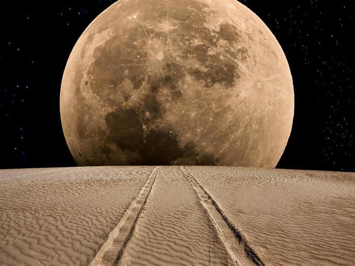 Tire track on the desert at supermoon night.