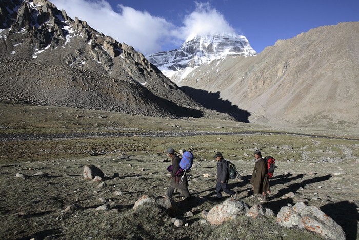 PURANG COUNTY, CHINA - JUNE 16:  (CHINA OUT) A nun from Nepal worships the snow-capped Kangrinboqe Mountain, known as Mt. Kailash in the West, June 16, 2007 in Purang County of Tibet Autonomous Region, China. Kangrinboqe, meaning  