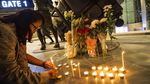 Bunga dan Lilin Hiasi Lokasi Penembakan Brutal di Thailand