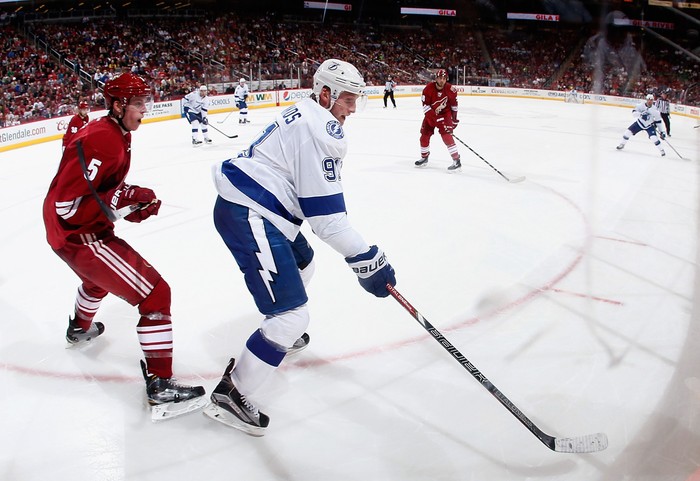 GLENDALE, AZ - FEBRUARY 21:  Steven Stamkos #91 of the Tampa Bay Lightning skates with the puck ahead of Connor Murphy #5 of the Arizona Coyotes during the second period of the NHL game at Gila River Arena on February 21, 2015 in Glendale, Arizona.  The Lighting defeated the Coyotes 4-2. (Photo by Christian Petersen/Getty Images)