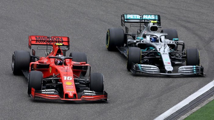 SHANGHAI, CHINA - APRIL 14: Charles Leclerc of Monaco driving the (16) Scuderia Ferrari SF90 leads Valtteri Bottas driving the (77) Mercedes AMG Petronas F1 Team Mercedes W10 on track during the F1 Grand Prix of China at Shanghai International Circuit on April 14, 2019 in Shanghai, China. (Photo by Charles Coates/Getty Images)