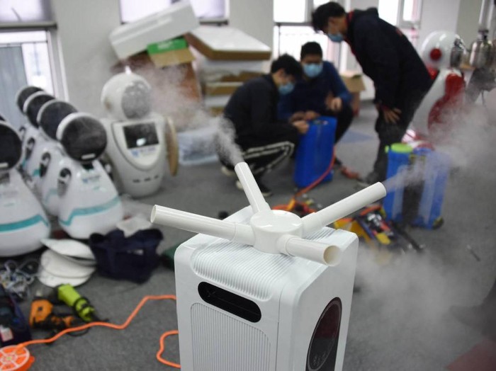 Medical workers checking on the robots that will be put on to the streets in China in the fight against the COVID-19 (coronavirus) outbreak in the country. A disinfection robot has been developed by scientists in Soochow University at Qingdao, East Chinas Shandong province, on Wednesday (Feb 12). - Xinhua/ANN