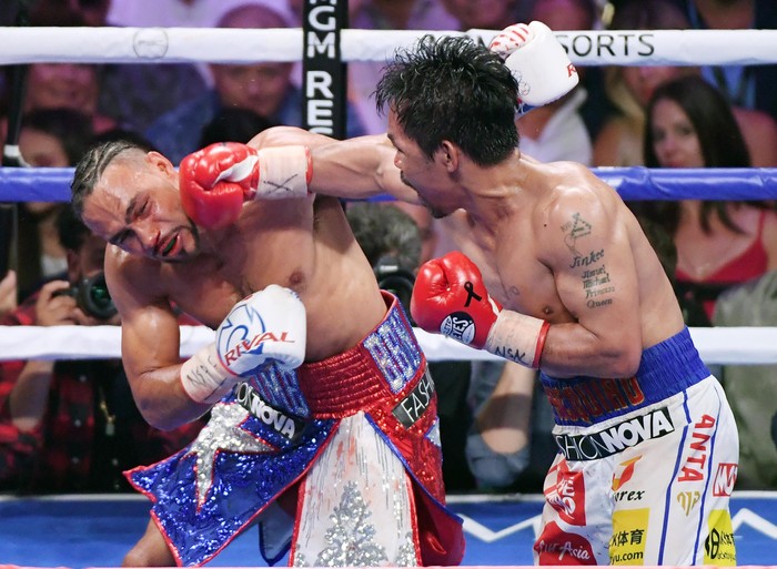 LAS VEGAS, NEVADA - JULY 20:  Manny Pacquiao (R) throws a right at Keith Thurman in the eighth round of their WBA welterweight title fight at MGM Grand Garden Arena on July 20, 2019 in Las Vegas, Nevada. Pacquiao won in a split decision.  (Photo by Ethan Miller/Getty Images)