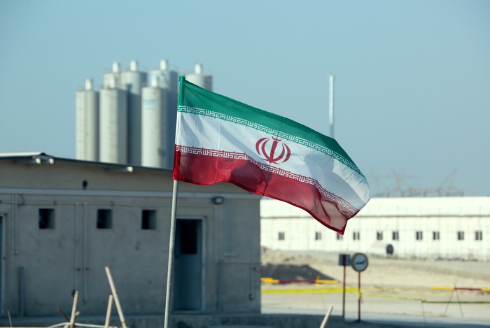 A picture taken on November 10, 2019, shows an Iranian flag in Irans Bushehr nuclear power plant, during an official ceremony to kick-start works on a second reactor at the facility. - Bushehr is Irans only nuclear power station and is currently running on imported fuel from Russia that is closely monitored by the UNs International Atomic Energy Agency. (Photo by ATTA KENARE / AFP)