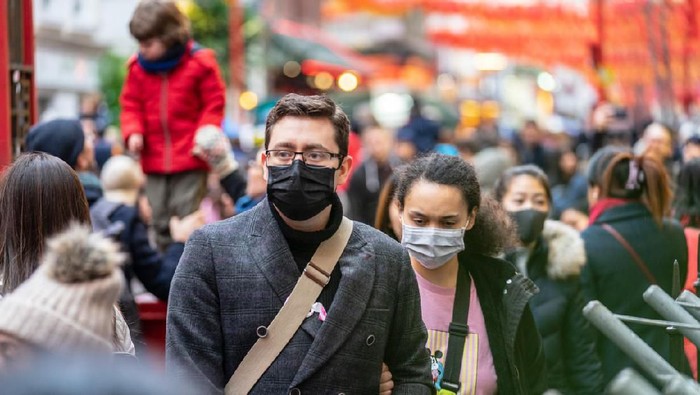 London, January 26, 2020. People wearing a face masks to protecting themself because of epidemic in China. Selective Focus. Concept of coronavirus quarantine. MERS-Cov, middle East respiratory syndrome coronavirus, Novel coronavirus 2019-nCoV.