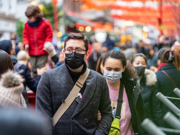 London, January 26, 2020. People wearing a face masks to protecting themself because of epidemic in China. Selective Focus. Concept of coronavirus quarantine. MERS-Cov, middle East respiratory syndrome coronavirus, Novel coronavirus 2019-nCoV.