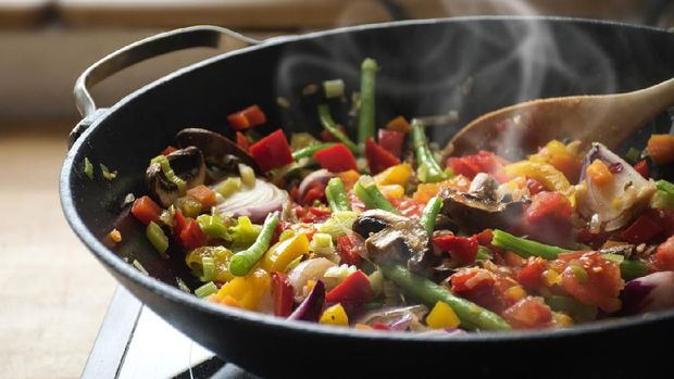 steaming mixed vegetables in the wok, asian style cooking vegetarian and healthy, selected focus, narrow depth of field