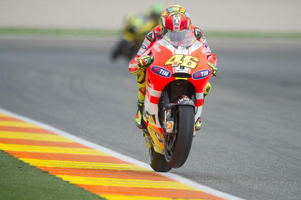VALENCIA, SPAIN - NOVEMBER 05:  Valentino Rossi of Italy and Ducati Marlboro Team lifts the front wheel during the qualifying practice of the MotoGP of Valencia at Ricardo Tormo Circuit on November 5, 2011 in Valencia, Spain.  (Photo by Mirco Lazzari gp/Getty Images)
