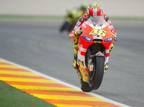 VALENCIA, SPAIN - NOVEMBER 05:  Valentino Rossi of Italy and Ducati Marlboro Team lifts the front wheel during the qualifying practice of the MotoGP of Valencia at Ricardo Tormo Circuit on November 5, 2011 in Valencia, Spain.  (Photo by Mirco Lazzari gp/Getty Images)