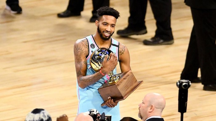 CHICAGO, ILLINOIS - FEBRUARY 15: Derrick Jones Jr. #5 of the Miami Heat celebrates with the trophy after winning the 2020 NBA All-Star - AT&T Slam Dunk Contest during State Farm All-Star Saturday Night at the United Center on February 15, 2020 in Chicago, Illinois. NOTE TO USER: User expressly acknowledges and agrees that, by downloading and or using this photograph, User is consenting to the terms and conditions of the Getty Images License Agreement. (Photo by Stacy Revere/Getty Images)