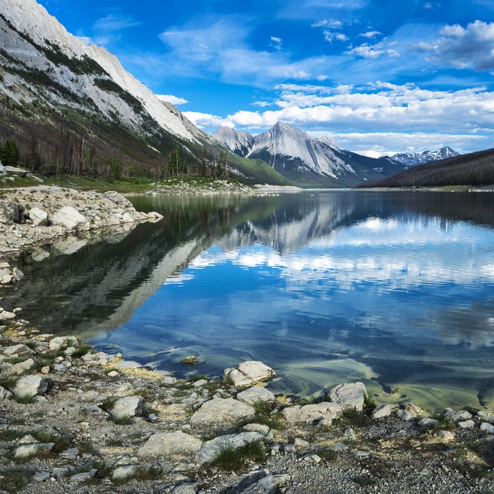 Medicine Lake in the beautiful wilderness landscape of the Canadian Rockies in Jasper National Park, Alberta, Canada.