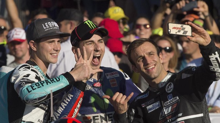 VALENCIA, SPAIN - NOVEMBER 08: (L-R) Danny Kent of Britain and Leopard Racing, Jorge Lorenzo of Spain and Movistar Yamaha MotoGP and Johann Zarco of Frence and AJO Motorsport pose for a selfie to celebrate the three Champions of the 2015 season during the MotoGP Race at Ricardo Tormo Circuit on November 8, 2015 in Valencia, Spain. (Photo by Mirco Lazzari gp/Getty Images)