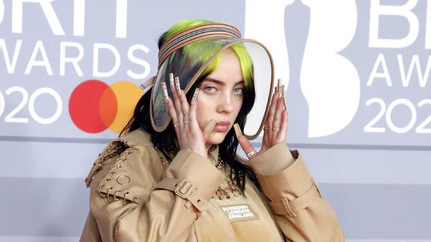 Billie Eilish and Finneas O'Connell pose for photographers upon arrival at Brit Awards 2020 in London, Tuesday, Feb. 18, 2020.(Photo by Vianney Le Caer/Invision/AP)