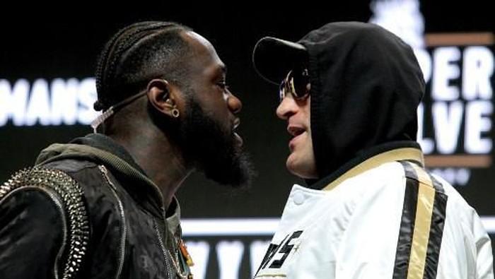 US boxer Deontay Wilder (L) and British boxer Tyson Fury get into an altercation during their press conference February 19, 2020 at the MGM Grand Las Vegas in Las Vegas, Nevada. - The boxers will fight for the World Boxing Council (WBC) Heavyweight Championship Title on February 22, 2020 at the MGM Grand Garden Arena in Las Vegas. (Photo by John Gurzinski / AFP)