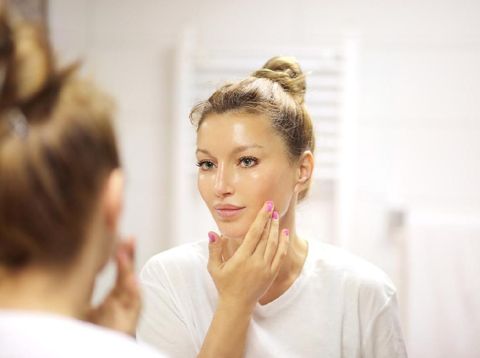Magic anti-aging cream.Applying the cream