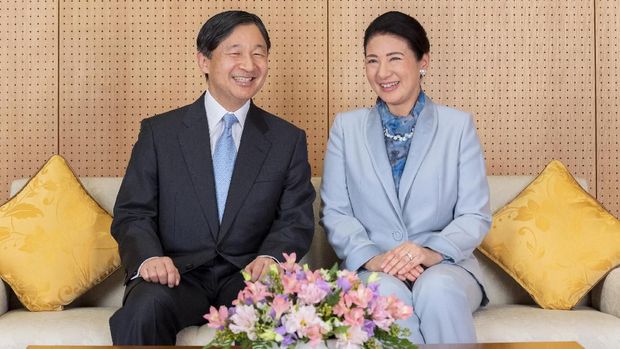 In this Feb. 12, 2020, photo released by Imperial Household Agency of Japan, Japan's Emperor Naruhito and his wife Empress Masako smile while looking at a book at their residence in Tokyo, ahead of his 60th birthday on Sunday, Feb. 23, 2020. Naruhito offered his sympathy to those affected by the new virus that emerged in China and said he hopes to see the outbreak contained soon. Birthday celebration plans had called for him to wave from the palace balcony to tens of thousands of well-wishers, but they were canceled as a precautionary anti-infection measure. (Imperial Household Agency of Japan via AP)