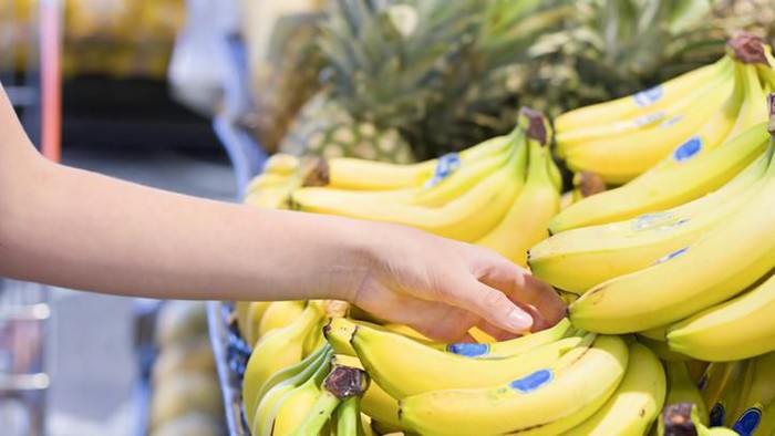 Female hand choosing vegetables in the store