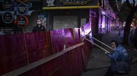 Akses menuju permukiman ditutup dan dijaga warga. Chinatopix via AP.
