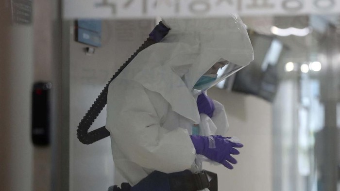 Electric screens about precautions against the illness COVID-19 are seen in a subway train in Seoul, South Korea, Sunday, Feb. 23, 2020. South Koreas president said Sunday that he was putting his country on its highest alert for infectious diseases and ordered officials to take 