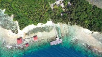 Hamparan pasir putih dan air laut yang membiru sangat memanjakan mata.