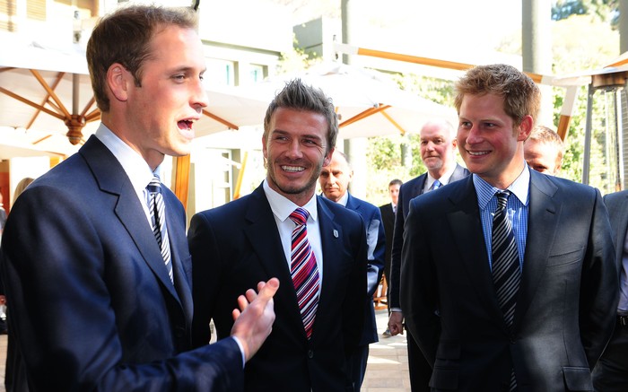 JOHANNESBERG, SOUTH AFRICA - JUNE 19:  Prince William and Prince Harry (R) smile with David Beckham (C) at an FA reception at the Saxon Hotel on June 19, 2010 in Johannesberg, South Africa. (Photo by Owen Humphreys - WPA Pool/Getty Images)