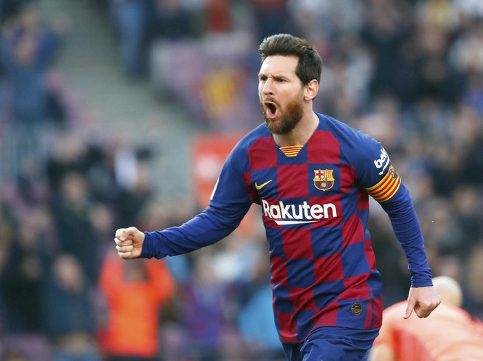 Barcelona's Lionel Messi celebrates after scoring his side's opening goal during a Spanish La Liga soccer match between Barcelona and Eibar at the Camp Nou stadium in Barcelona, Spain, Saturday Feb. 22, 2020. (AP Photo/Joan Monfort)
