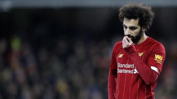 Liverpool's Mohamed Salah leaves the field at the end of the English Premier League soccer match between Watford and Liverpool at Vicarage Road stadium, in Watford, England, Saturday, Feb. 29, 2020. The match finished 3-0. (AP Photo/Alastair Grant)