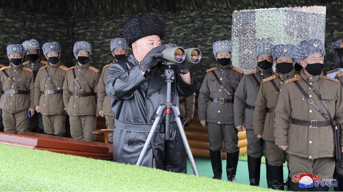 FILE - In this Friday, Feb. 28, 2020, file photo provided on Feb. 29, 2020 by the North Korean government, North Korean leader Kim Jong Un, center, inspects the military drill of units of the Korean Peoples Army, with soldiers shown wearing face masks. South Korea’s military says North Korea has fired at least one unidentified projectile. The launch on Monday, March 2, 2020 came two days North Korea’s state media said leader Kim supervised an artillery drill aimed at testing the combat readiness of units in front-line and eastern areas. Independent journalists were not given access to cover the event depicted in this image distributed by the North Korean government. The content of this image is as provided and cannot be independently verified. Korean language watermark on image as provided by source reads: KCNA which is the abbreviation for Korean Central News Agency. (Korean Central News Agency/Korea News Service via AP, File)
