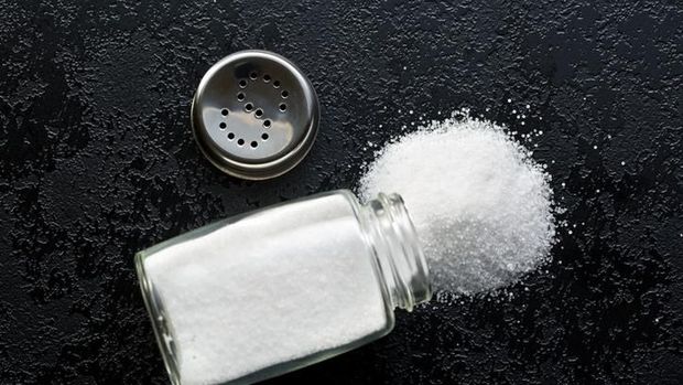 salt shaker on black kitchen table