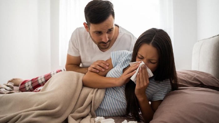 Woman is sick. Husband is worried.