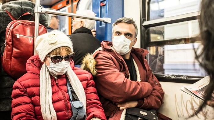 Athens, Greece - February 18, 2019: The H1N1 virus, known as swine flu, has killed 56 people in Greece. In February of  2019, 18 people in intensive care units died due to H1N1 virus. People protect their self with the mask.