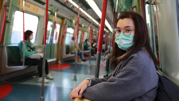 Corona masked girl to protect herself from wuhan virus in public area