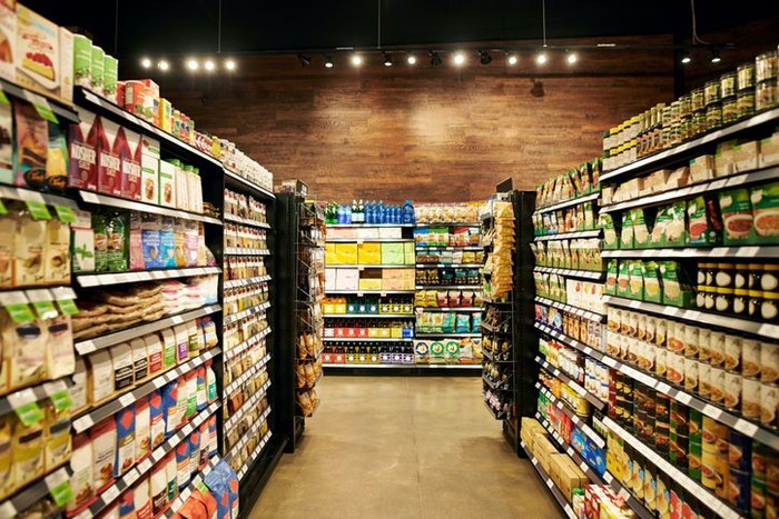 West Palm Beach, USA - October 28, 2011: This is a studio closeup shot of a selection of brand name groceries. In full view are Bushs baked beans, Planters peanuts, Frenchs mustard and fried onions, Folgers coffee, Bumblebee tuna fish, and Nutella cocoa spread. Other products are partially visible in the background. This is a collection of some of the basic staples found in many American kitchens.