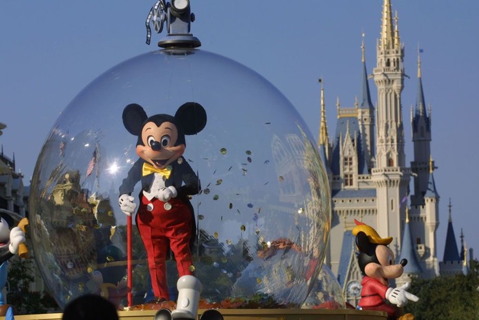 397155 06: Mickey Mouse rides in a parade through Main Street, USA with Cinderellas castle in the background at Disney Worlds Magic Kingdom November 11, 2001 in Orlando, Florida. (Photo by Joe Raedle/Getty Images)
