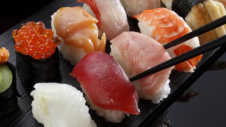 sushi Big futomaki sushi with salmon, prawn tempura and cucumber