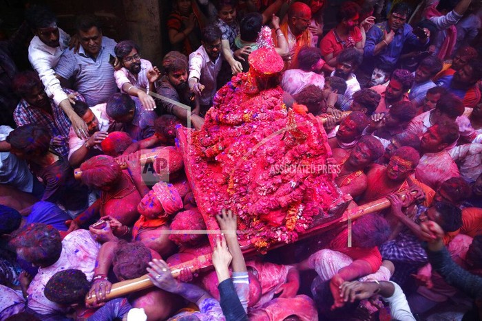 Hindu devotees carry idols of Lord Shiva and Goddess Parvati during Rangbhari Ekadashi in the alleys of Varanasi, India, Thursday, March 5, 2020. Rangbhari Ekadashi marks the beginning of Holi celebrations in Varanasi, the Hindu festival of colors. (AP Photo/Rajesh Kumar Singh)