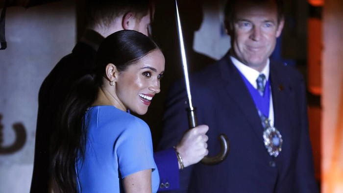 Britains Prince Harry and Meghan, the Duchess of Sussex, leave after attending the annual Endeavour Fund Awards in London, Thursday, March 5, 2020. The awards celebrate the achievements of service personnel who were injured in service and have gone on to use sport as part of their recovery and rehabilitation. (AP Photo/Kirsty Wigglesworth)