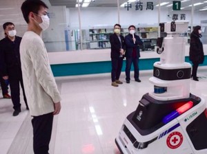 Robot hingga Helm Pintar, Kecanggihan yang Dipakai China Lawan Corona