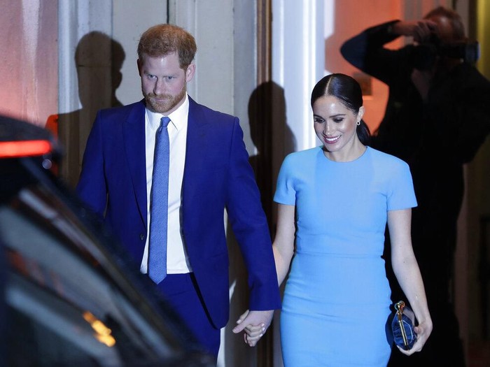 Britains Prince Harry and Meghan, the Duchess of Sussex, leave after attending the annual Endeavour Fund Awards in London, Thursday, March 5, 2020. The awards celebrate the achievements of service personnel who were injured in service and have gone on to use sport as part of their recovery and rehabilitation. (AP Photo/Kirsty Wigglesworth)
