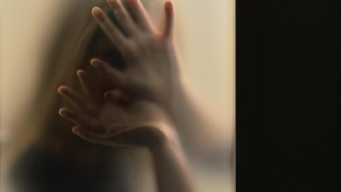 1124699511 Girl behind frosted glass