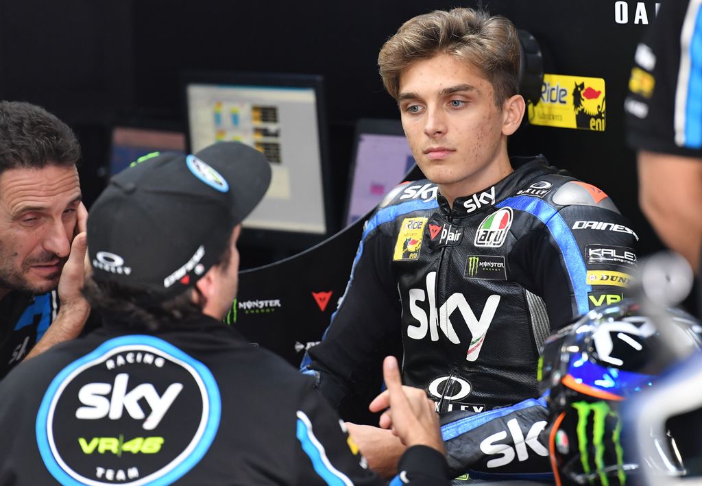 Sky Racing Team VR46 rider Luca Marini of Italy (R) listens to his mechanic in his pit  during the Moto2 qualifying session of Japanese Motorcycle Grand Prix at the Twin Ring Motegi circuit in Motegi, Tochigi prefecture on October 19, 2019. (Photo by Toshifumi KITAMURA / AFP)