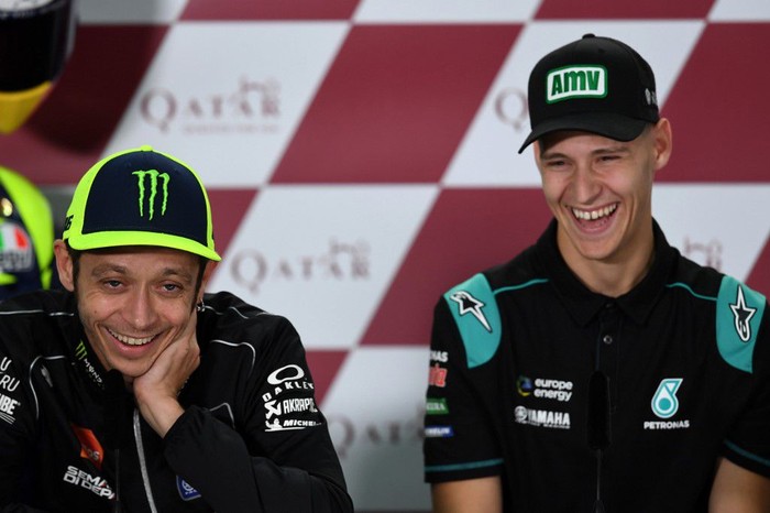 Yamaha MotoGPs Valentino Rossi of Italy (L) and Petronas Yamaha SRTs Fabio Quartararo attend a press conference at Losail Circuit in Doha on March 7, 2019, ahead of the seasons start at Qatar MotoGP grand prix on March 10. (Photo by GIUSEPPE CACACE / AFP)
